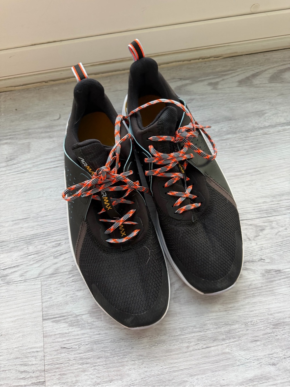 Nike Black Sneakers with Orange-Patterned Laces